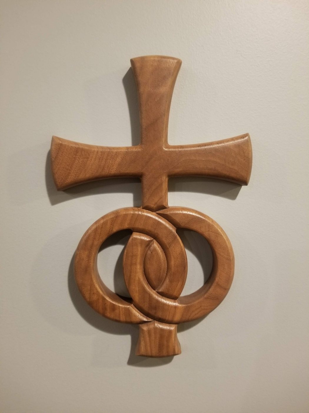 Cross and two rings